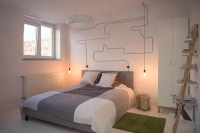 Łóżko lub łóżka w pokoju w obiekcie Willow Pillow Nowowiejska