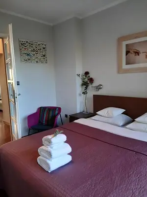 Łóżko lub łóżka w pokoju w obiekcie City Center Boutique Apartment