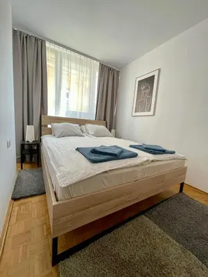 Łóżko lub łóżka w pokoju w obiekcie Stare Miasto - Trębacka