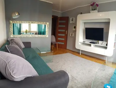 Telewizja i/lub zestaw kina domowego w obiekcie DELUXE WIDOK 24 APARTMENT