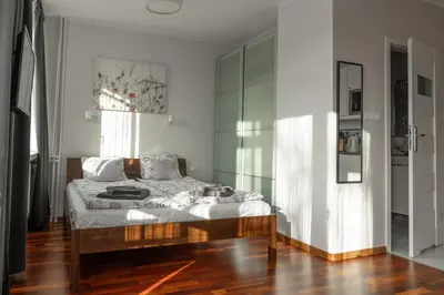 Łóżko lub łóżka w pokoju w obiekcie Przytulny Apartament przy Teatrze Wielkim