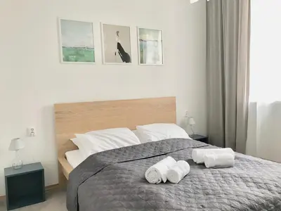 Łóżko lub łóżka w pokoju w obiekcie Chmielna Warsaw Plus