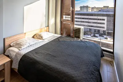 Łóżko lub łóżka w pokoju w obiekcie Apartamenty Triton Park