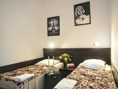 Łóżko lub łóżka w pokoju w obiekcie Hostel Evotel