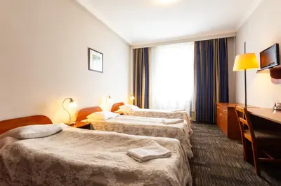 Łóżko lub łóżka w pokoju w obiekcie Noclegi Stadion Bed & Breakfast