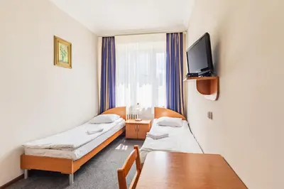Łóżko lub łóżka w pokoju w obiekcie Noclegi Stadion Bed & Breakfast