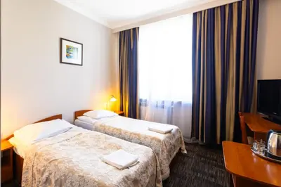 Łóżko lub łóżka w pokoju w obiekcie Noclegi Stadion Bed & Breakfast