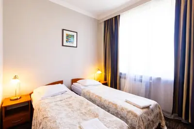 Łóżko lub łóżka w pokoju w obiekcie Noclegi Stadion Bed & Breakfast