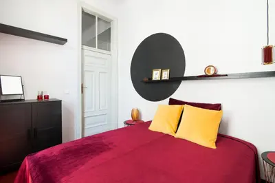 Łóżko lub łóżka w pokoju w obiekcie Aparthotel Nowy Świat 28
