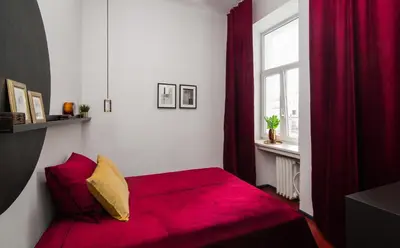 Łóżko lub łóżka w pokoju w obiekcie Aparthotel Nowy Świat 28