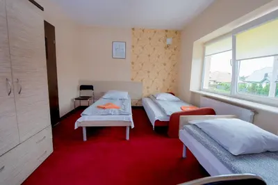 Łóżko lub łóżka w pokoju w obiekcie Hotelik Jankowski