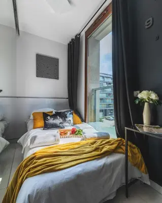 Łóżko lub łóżka w pokoju w obiekcie 19 Dzielnica Kolejowa P&O Serviced Apartments