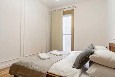 Łóżko lub łóżka w pokoju w obiekcie 19 Dzielnica Kolejowa P&O Serviced Apartments