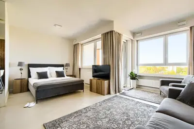 Łóżko lub łóżka w pokoju w obiekcie LuxLux Apartments Afara