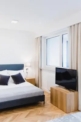 Łóżko lub łóżka w pokoju w obiekcie LuxLux Apartments Silver Dove
