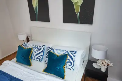Łóżko lub łóżka w pokoju w obiekcie Noctis Apartment Plac Grzybowski