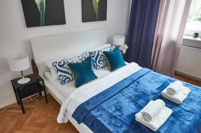 Łóżko lub łóżka w pokoju w obiekcie Noctis Apartment Plac Grzybowski