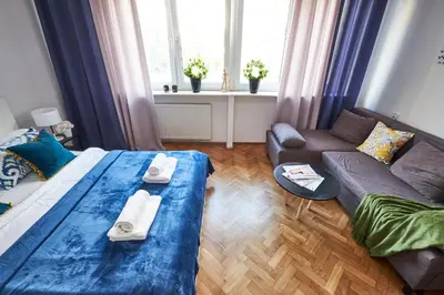 Łóżko lub łóżka w pokoju w obiekcie Noctis Apartment Plac Grzybowski
