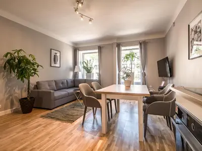 Telewizja i/lub zestaw kina domowego w obiekcie WHITE RESIDENCE 4rooms - CITY CENTER