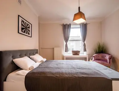 Łóżko lub łóżka w pokoju w obiekcie WHITE RESIDENCE 4rooms - CITY CENTER