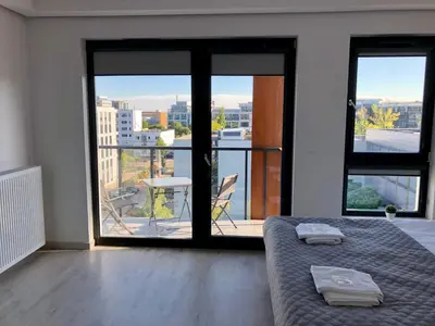 Łóżko lub łóżka w pokoju w obiekcie Living Point Residence