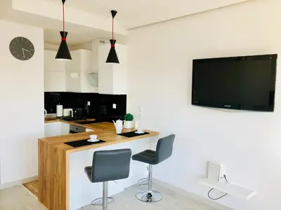 Telewizja i/lub zestaw kina domowego w obiekcie Living Point Residence