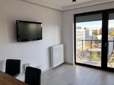 Telewizja i/lub zestaw kina domowego w obiekcie Living Point Residence
