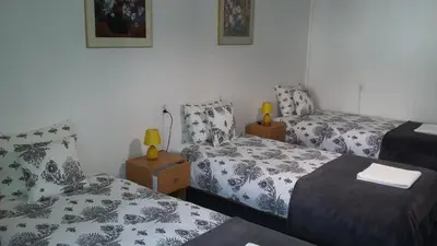 Łóżko lub łóżka w pokoju w obiekcie Animrumru