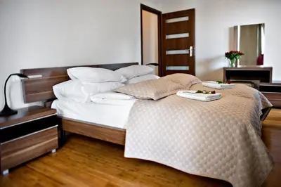 Łóżko lub łóżka w pokoju w obiekcie P&O Serviced Apartments Bukowinska