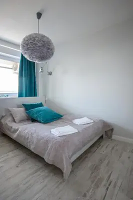Łóżko lub łóżka w pokoju w obiekcie Apartament Świętokrzyska