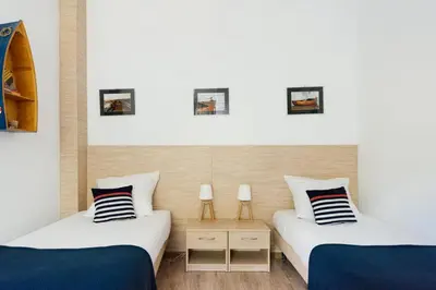 Łóżko lub łóżka w pokoju w obiekcie Villa Lulu