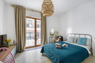 Łóżko lub łóżka w pokoju w obiekcie Aparthotel Pawia Deluxe- 10 min to center