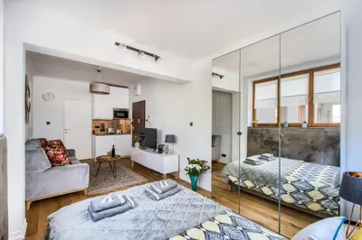 Łóżko lub łóżka w pokoju w obiekcie Aparthotel Pawia Deluxe- 10 min to center