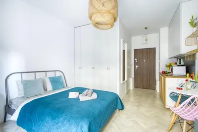 Łóżko lub łóżka w pokoju w obiekcie Aparthotel Pawia Deluxe- 10 min to center