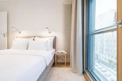 Łóżko lub łóżka w pokoju w obiekcie Mennica Residence Norblin Area