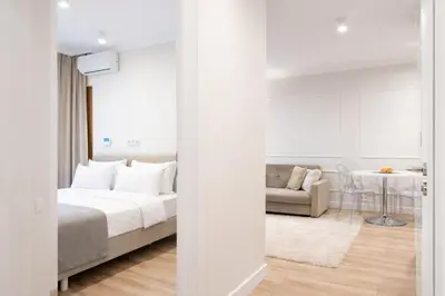 Łóżko lub łóżka w pokoju w obiekcie Mennica Residence Norblin Area