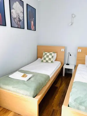 Łóżko lub łóżka w pokoju w obiekcie Warsaw Concierge Koszykowa