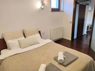 Łóżko lub łóżka w pokoju w obiekcie Warsaw Concierge Koszykowa