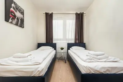 Łóżko lub łóżka w pokoju w obiekcie Al Krakowska 291A by Homeprime