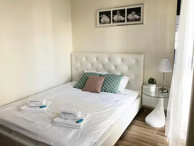 Łóżko lub łóżka w pokoju w obiekcie Al Krakowska 291A by Homeprime