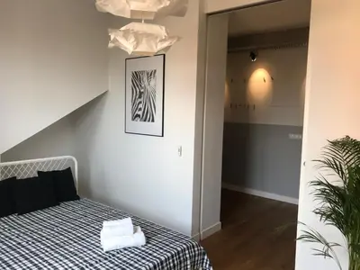Łóżko lub łóżka w pokoju w obiekcie Apartament 