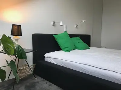 Łóżko lub łóżka w pokoju w obiekcie Apartament 