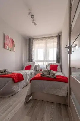 Łóżko lub łóżka w pokoju w obiekcie Metropolia Business Deluxe APT, AC, WiFi, Parking, FV