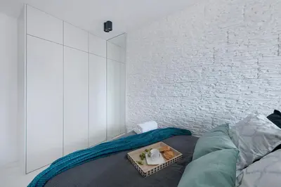 Łóżko lub łóżka w pokoju w obiekcie ZGODA 13 P&O Serviced Apartments