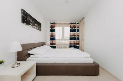 Łóżko lub łóżka w pokoju w obiekcie ShortStayPoland Krakowska (B65)