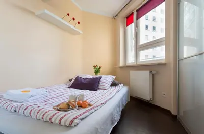 Łóżko lub łóżka w pokoju w obiekcie Zygmunta Slominskiego 5 - P&O Apartments