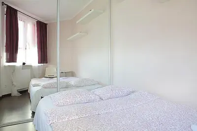 Łóżko lub łóżka w pokoju w obiekcie Zygmunta Slominskiego 5 - P&O Apartments