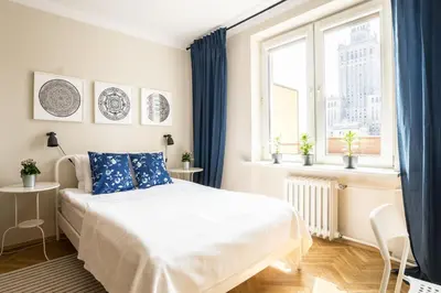 Łóżko lub łóżka w pokoju w obiekcie ★Bright, spacious apartment|Palace of Culture view★