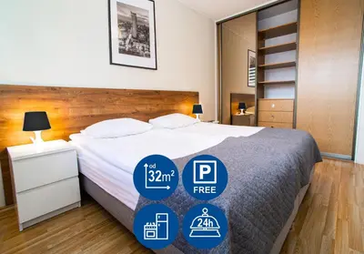 Łóżko lub łóżka w pokoju w obiekcie Warsaw Apartments - Apartamenty Wilanów
