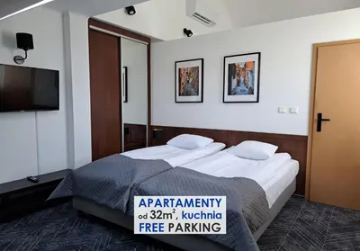 Łóżko lub łóżka w pokoju w obiekcie Warsaw Apartments - Apartamenty Wilanów
